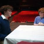 Elias Bouschor and Ada Bon rehearse Our Town in the Soldotna High School Auditorium in Soldotna, Alaska, on Friday, April 18, 2025. (Jake Dye/Peninsula Clarion)