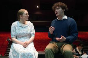 Emerson Kapp and Elias Bouschor rehearse Our Town in the Soldotna High School Auditorium in Soldotna, Alaska, on Friday, April 18, 2025. (Jake Dye/Peninsula Clarion)