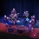 The Americas First Corps Band Brass Quintet perform during the opening of the new Triumvirate Theatre in Kenai, Alaska, on Saturday, April 19, 2025. (Jake Dye/Peninsula Clarion)