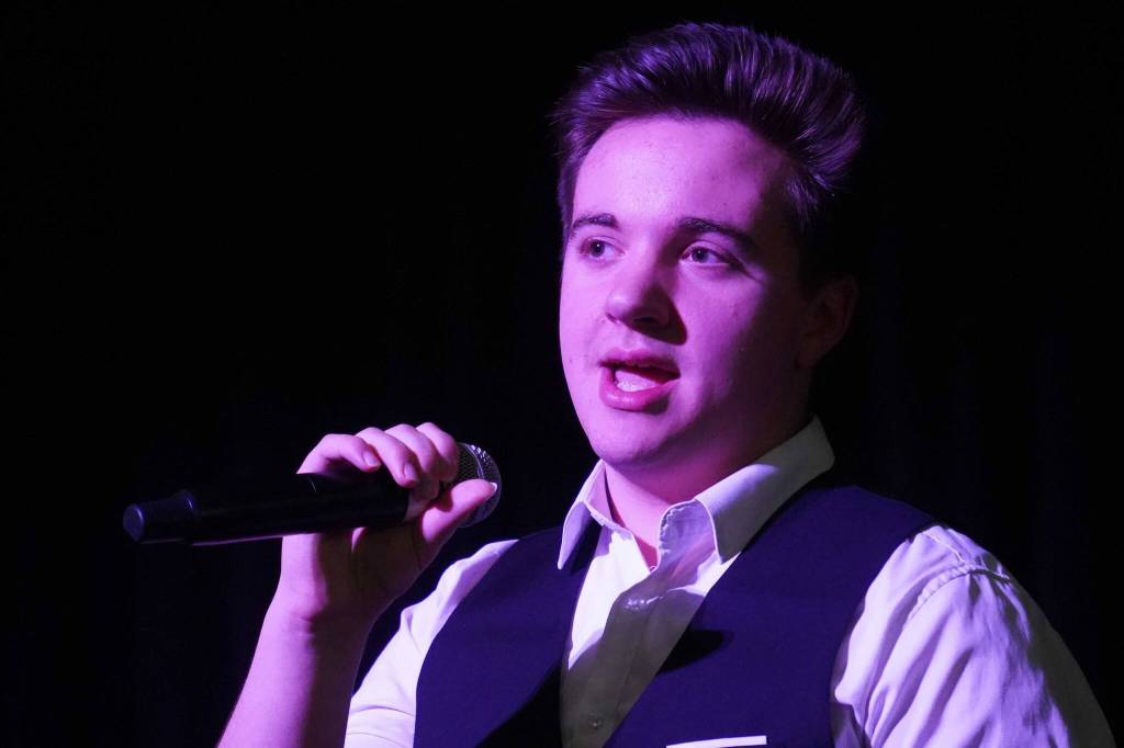 Jackson Hooper performs during the opening of the new Triumvirate Theatre in Kenai, Alaska, on Saturday, April 19, 2025. (Jake Dye/Peninsula Clarion)