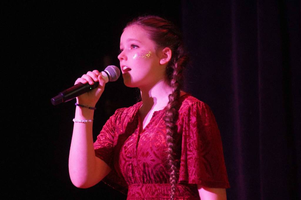 Ella Mallard performs during the opening of the new Triumvirate Theatre in Kenai, Alaska, on Saturday, April 19, 2025. (Jake Dye/Peninsula Clarion)