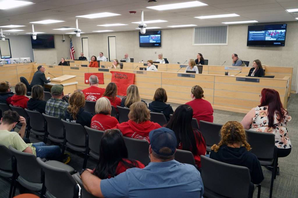 Dozens of supporters of Sterling Elementary School watch as Kenai Peninsula Borough Mayor Peter Micciche speaks during a special meeting of the Kenai Peninsula Borough School District Board of Education in Soldotna, Alaska, on Wednesday, April 23, 2025. (Jake Dye/Peninsula Clarion)