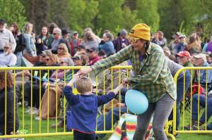 Attendees gather to dance and to listen during a performance by Blackwater Railroad Company, part of the Levitt AMP Soldotna Music Series on Wednesday, June 7, 2023, at Soldotna Creek Park. (Jake Dye/Peninsula Clarion)