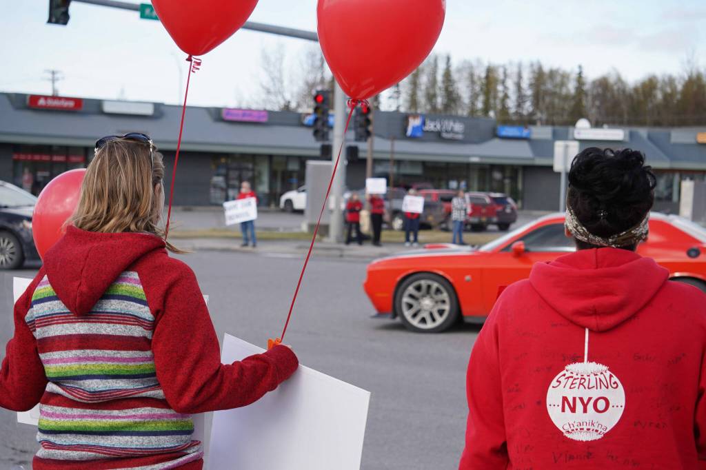 Parents and teachers protest the possible closure of Sterling Elementary School along the Sterling Highway in Soldotna, Alaska, on Saturday, May 3, 2025. (Jake Dye/Peninsula Clarion)