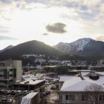 A few clouds disrupt the sunlight in downtown Juneau on an otherwise bright day. (Jasz Garrett / Juneau Empire file photo)