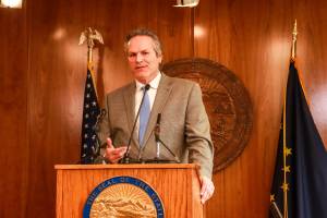 Gov. Mike Dunleavy (R-Alaska) speaks to reporters about his decision to veto an education funding bill at the Alaska State Capitol on Thursday, April 17, 2025. (Jasz Garrett / Juneau Empire file photo)