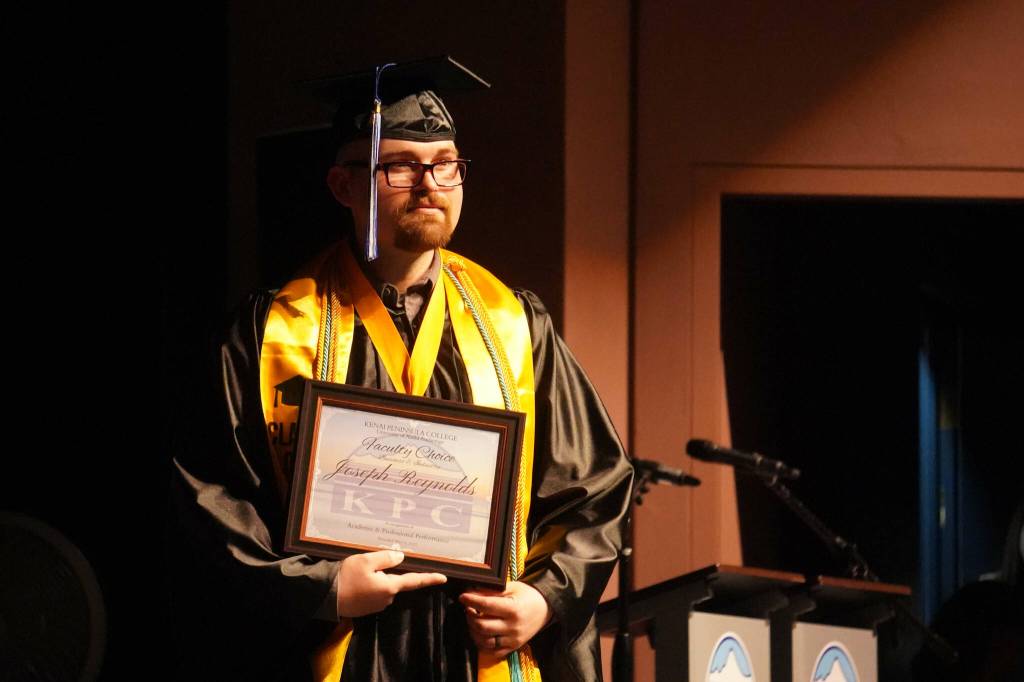 Joseph Reynolds is honored as Faculty Choice during the 55th Annual Kenai Peninsula College Commencement Ceremony, held at Kenai Central High School in Kenai, Alaska, on Thursday, May 8, 2025. (Jake Dye/Peninsula Clarion)