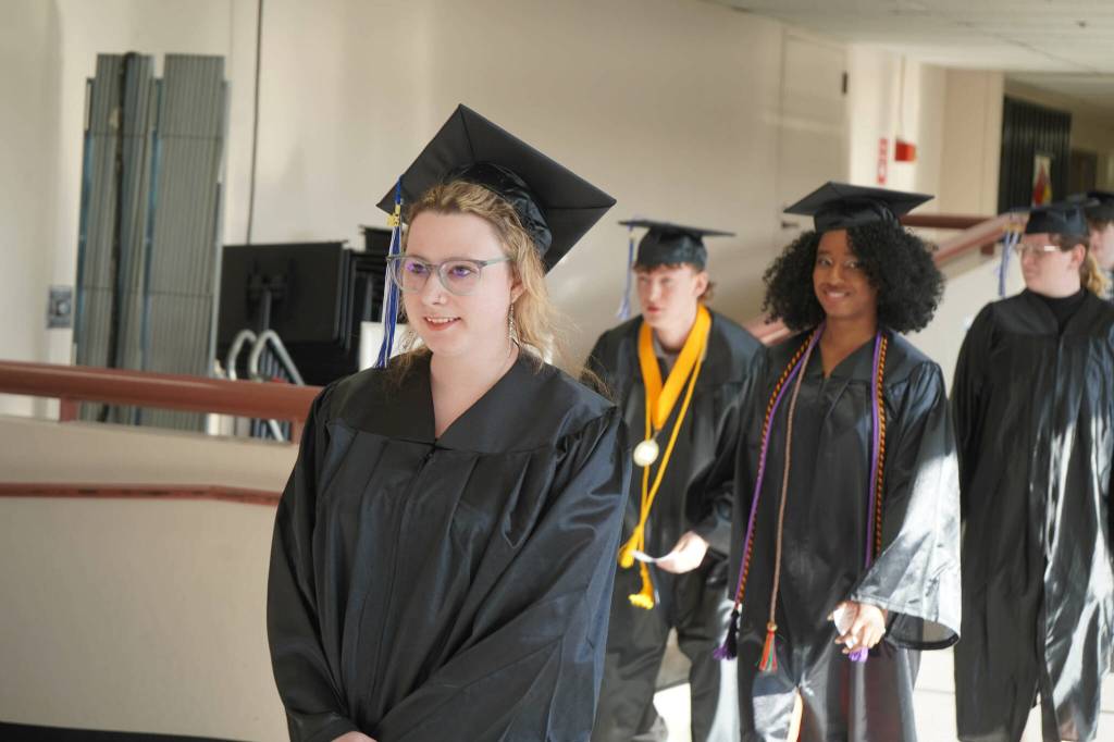 Graduates process into the 55th Annual Kenai Peninsula College Commencement Ceremony, held at Kenai Central High School in Kenai, Alaska, on Thursday, May 8, 2025. (Jake Dye/Peninsula Clarion)