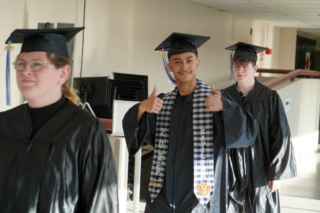 Graduates process into the 55th Annual Kenai Peninsula College Commencement Ceremony, held at Kenai Central High School in Kenai, Alaska, on Thursday, May 8, 2025. (Jake Dye/Peninsula Clarion)