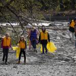 Sterling Elementary School students collect trash from the banks of the Kenai River near Bings Landing in Sterling, Alaska, during the 10th Annual Kenai River Spring Cleanup on Wednesday, May 14, 2025. (Jake Dye/Peninsula Clarion)