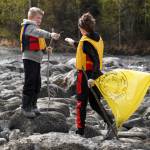 Sterling Elementary School students collect trash from the banks of the Kenai River near Bings Landing in Sterling, Alaska, during the 10th Annual Kenai River Spring Cleanup on Wednesday, May 14, 2025. (Jake Dye/Peninsula Clarion)