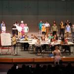 Kaleidoscope School of Arts and Science students perform Lets Eat, their fifth grade musical, at Kenai Central High School in Kenai, Alaska, on Tuesday, May 13, 2025. (Jake Dye/Peninsula Clarion)
