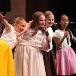 Kaleidoscope School of Arts and Science students perform Lets Eat, their fifth grade musical, at Kenai Central High School in Kenai, Alaska, on Tuesday, May 13, 2025. (Jake Dye/Peninsula Clarion)