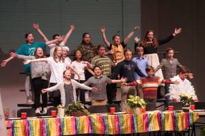Kaleidoscope School of Arts and Science students perform Lets Eat, their fifth grade musical, at Kenai Central High School in Kenai, Alaska, on Tuesday, May 13, 2025. (Jake Dye/Peninsula Clarion)