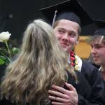 Nikiski graduates bring roses to their supporters during a commencement ceremony at Nikiski/Middle High School in Nikiski, Alaska, on Monday, May 19, 2025. (Jake Dye/Peninsula Clarion)