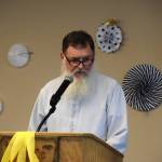 Michael Wojciak, principal of Voznesenka and Kachemak-Selo schools, speaks to the graduates and their families at the commencement ceremony held Monday, May 19, 2025, at Lands End Resort in Homer, Alaska. (Delcenia Cosman/Homer News)