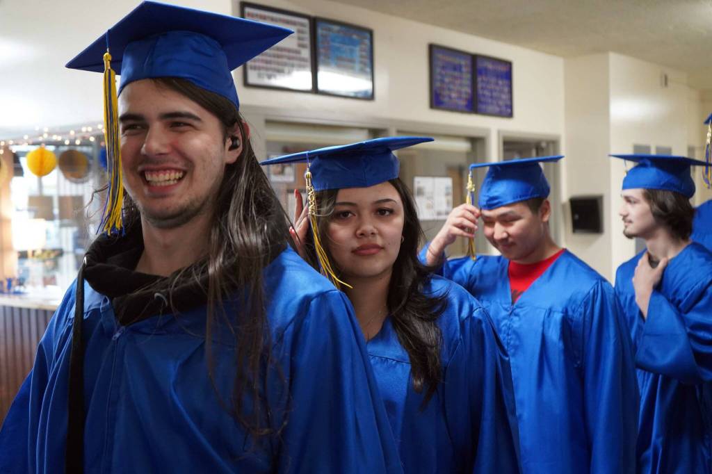 Kenai Alternative High School graduates process into their commencement ceremony in the schools gym in Kenai, Alaska, on Wednesday, May 22, 2025. (Jake Dye/Peninsula Clarion)