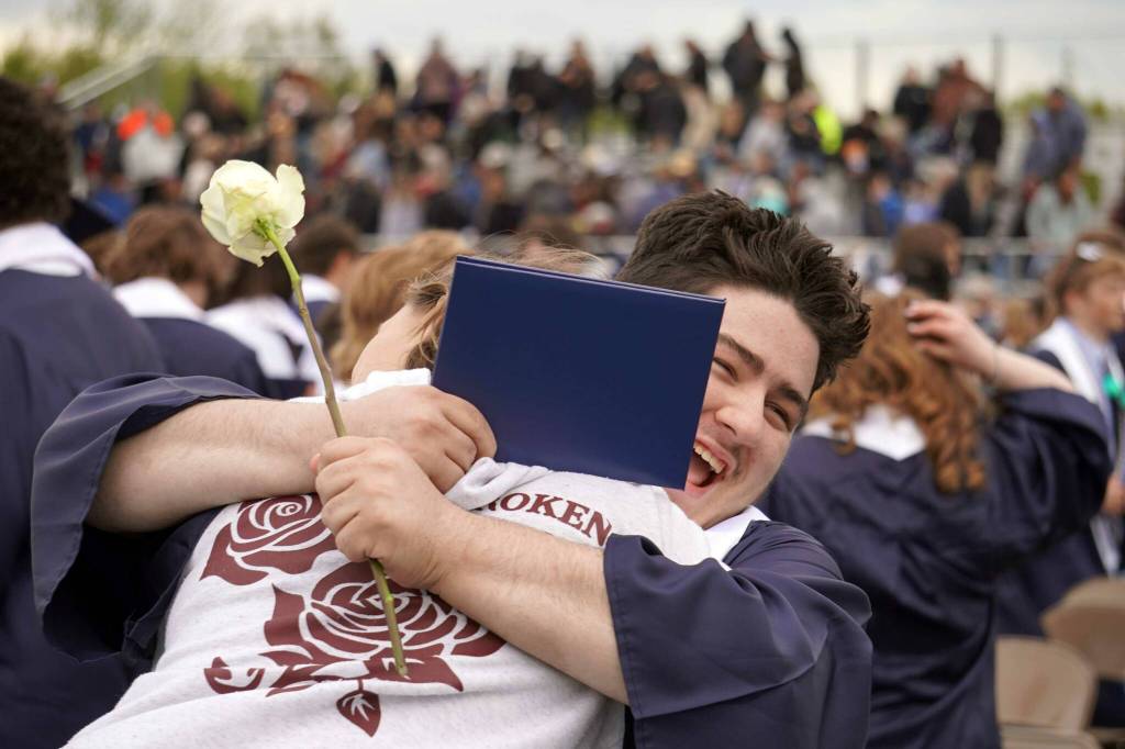 Graduates of Soldotna High School celebrate after receiving their diplomas on the schools football field in Soldotna, Alaska, on Wednesday, May 21, 2025. (Jake Dye/Peninsula Clarion)