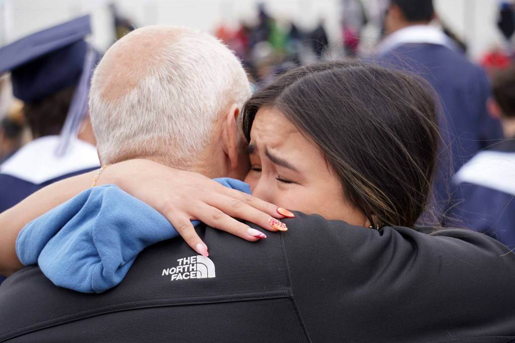 Graduates of Soldotna High School celebrate after receiving their diplomas on the schools football field in Soldotna, Alaska, on Wednesday, May 21, 2025. (Jake Dye/Peninsula Clarion)