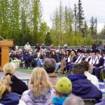 Annie Burns, senior class vice president at Soldotna High School, introduces the commencement speaker during a graduation ceremony on the schools football field in Soldotna, Alaska, on Wednesday, May 21, 2025. (Jake Dye/Peninsula Clarion)