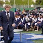 Commencement speaker Sarge Truesdell of Soldotna High School steps down from the stage after delivering a commencement address to graduates of Soldotna High School on the schools football field in Soldotna, Alaska, on Wednesday, May 21, 2025. (Jake Dye/Peninsula Clarion)