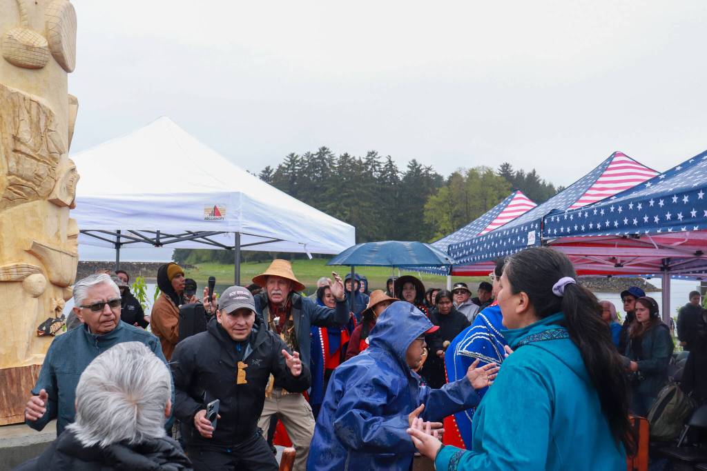 People dance in celebration of the Fishermans Honor Totem Pole in Hoonah on Friday, May 30, 2025. (Jasz Garrett / Juneau Empire)