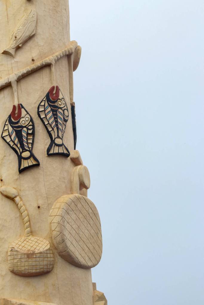 The Fishermans Honor Totem Pole is unveiled in Hoonah on Friday, May 30, 2025. (Jasz Garrett / Juneau Empire)
