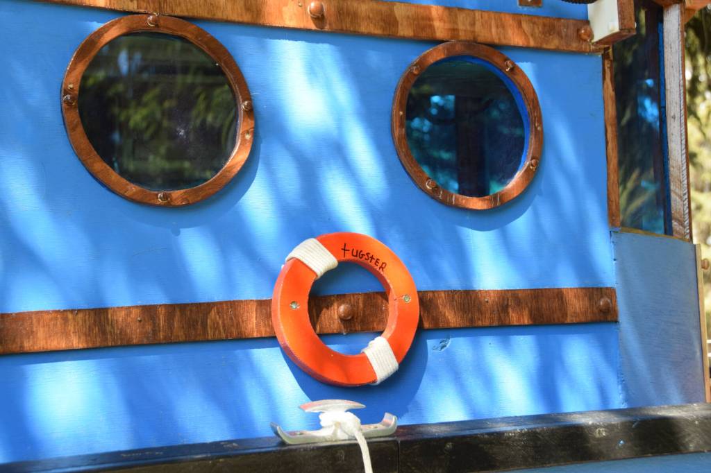 Little port windows, tinted blue on Thursday, June 5, 2025 in Homer, Alaska. (Chloe Pleznac/Homer News)
