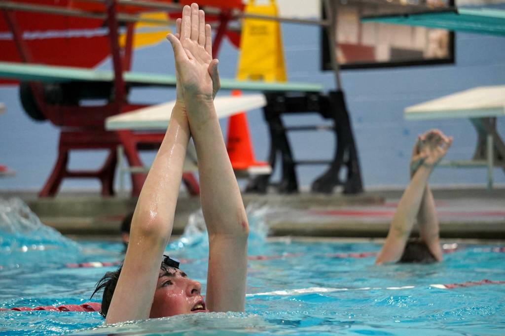 Swimmers from the Peninsula Piranhas swim team practice a difficult variation on treading water at Kenai Central High School in Kenai, Alaska, on Tuesday, June 17, 2025. (Jake Dye/Peninsula Clarion)