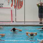 Pool manager and swim coach Will Hubler leads a treading water exercise at Kenai Central High School in Kenai, Alaska, on Tuesday, June 17, 2025. (Jake Dye/Peninsula Clarion)