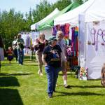 Shoppers mosey through the Saturday Market at the Goods in Soldotna, Alaska, on Saturday, June 14, 2025. (Jake Dye/Peninsula Clarion)