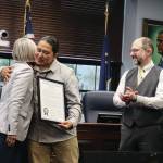 X̱unei Lance Twitchell receives his legislative citation from Rep. Andi Story, D Juneau, at a ceremony at the Alaska State Capitol on Saturday. (Ellie Ruel / Juneau Empire)