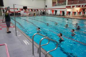 Pool manager and swim coach Will Hubler leads a treading water exercise at Kenai Central High School in Kenai, Alaska, on Tuesday, June 17, 2025. (Jake Dye/Peninsula Clarion)