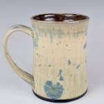 Mugs by Homer potter Jeff Szarzi are on display in a collaborative exhibit with painter Gail Priday through July 2025 at Bunnell Street Arts Center in Homer, Alaska. Photo provided by Bunnell Street Arts Center