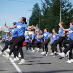 Forever Dance Alaska performers deliver a routine while walking with the 67th Annual Soldotna Progress Days Parade on Marydale Avenue in Soldotna, Alaska, on Saturday, July 27, 2024. (Jake Dye/Peninsula Clarion)