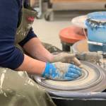 A community member works with clay on a wheel in the ceramics studio at Homer Council on the Arts in Homer, Alaska. Photo provided by Homer Council on the Arts