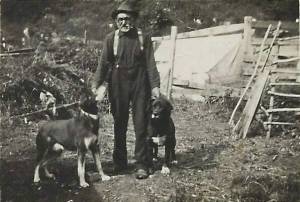 Steve Melchior in his Seward yard with two of his many dogs, probably circa mid-1920s. (Photo courtesy of the Melchior Family Collection)
