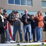Soldotna Mayor Paul Whitney cuts a ceremonial ribbon for the Soldotna Field House during its grand opening in Soldotna, Alaska, on Saturday, Aug. 16, 2025. (Jake Dye/Peninsula Clarion)