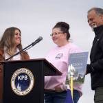 Jennifer Scheller, manager of Cooks Corner, speaks after receiving the Outstanding Support Business in Tourism Award during the 2025 Industry Appreciation Day at the Kenai Softball Greenstrip in Kenai, Alaska, on Saturday, Aug. 23, 2025. (Jake Dye/Peninsula Clarion)