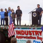 Rep. Justin Ruffridge introduces Dr. Rob McAlpine, who received the Outstanding Business in Health Care Award for Peninsula Pediatric Dentistry during the 2025 Industry Appreciation Day at the Kenai Softball Greenstrip in Kenai, Alaska, on Saturday, Aug. 23, 2025. (Jake Dye/Peninsula Clarion)