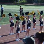 Homer Mariner cheerleaders rouse the gathered crowd at the first home game of the season on Friday. (Chloe Pleznac/Homer News)
