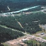 This 1960 aerial Soldotna shows the scar formed by the Soldotna Gravel Pit, where the Borough Administration Building now stands. Other interesting notes: To the left of the gravel pit is a large Quonset hut, which at this time was the Soldotna Theatre. In the lower right corner of the photo are Soldotna Elementary Schools first four classes under construction  the school would open to students in the fall  and, nearby, the barn that once comprised part of Joe Faas corral, for which Corral Street was later named. (Photo courtesy of Al Hershberger)
