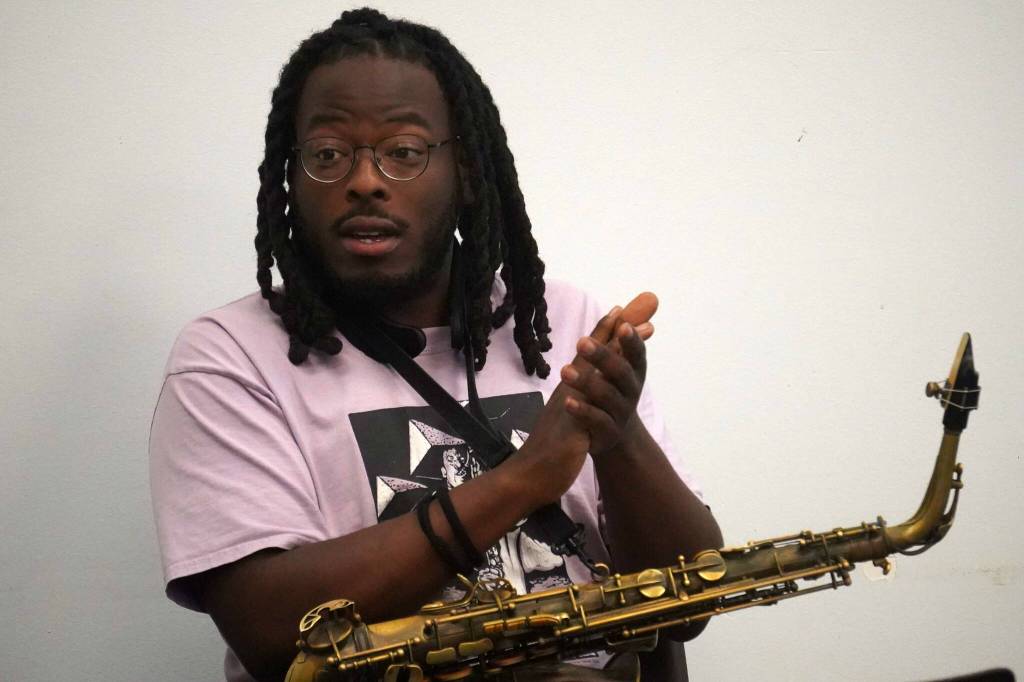 Joseph Miller encourages the audience to clap along during a jazz workshop put on by Svetlana and the New York Collective at the Soldotna Public Library in Soldotna, Alaska, on Tuesday, Aug. 26, 2025. (Provided by KDLL 91.9 FM)