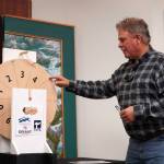 Kenai Mayor Brian Gabriel spins the wheel to determine the magic weight for the first day of the Ninth Annual Kenai Silver Salmon Derby at the Kenai Chamber of Commerce in Kenai, Alaska, on Tuesday, Sept. 9, 2025. (Jake Dye/Peninsula Clarion)