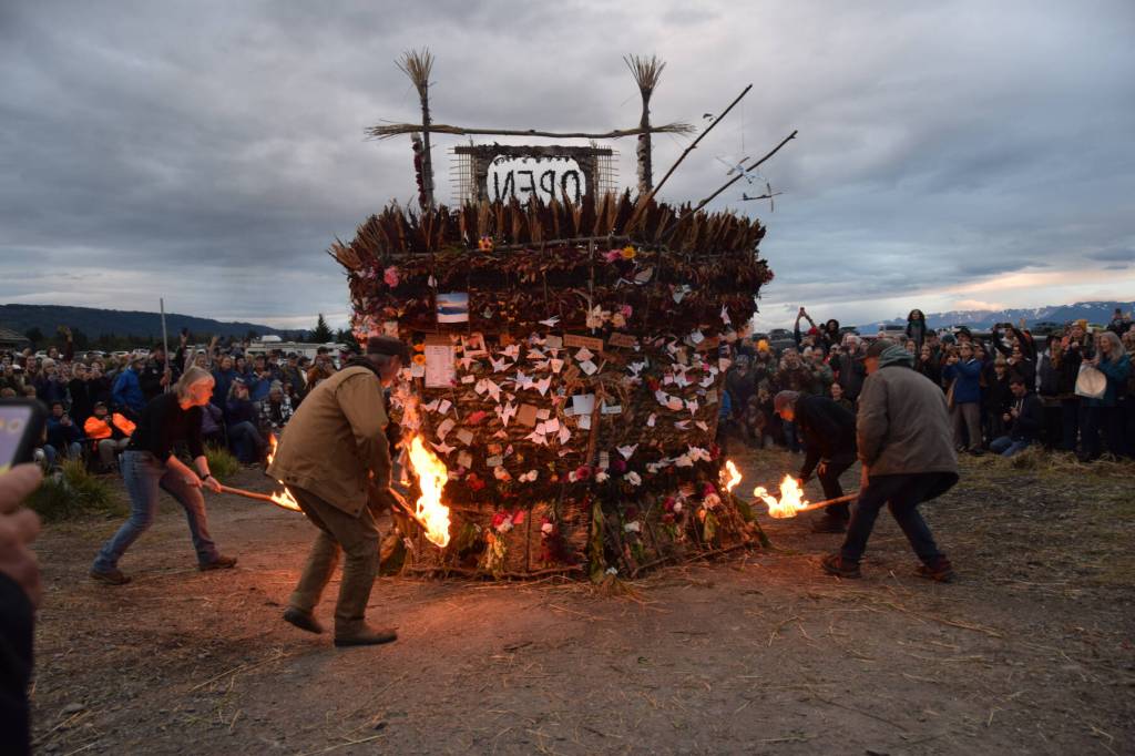 Torch bearers ignite the basket on Sunday, Sept. 7, 2025, at Mariner Park in Homer, Alaska. (Chloe Pleznac/Homer News)