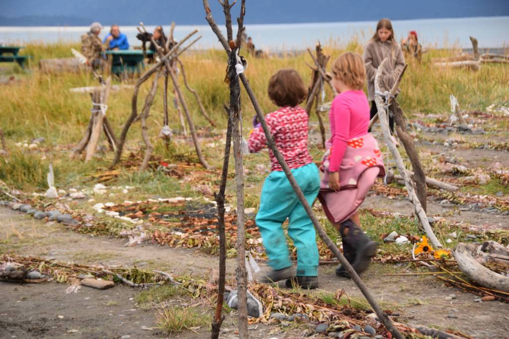 Two children walk the spiral path on Sunday, Sept. 7, 2025, at Mariner Park in Homer, Alaska. The impermanent trail was created earlier this week by Fireweed Academy students. (Chloe Pleznac/Homer News)
