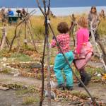 Two children walk the spiral path on Sunday, Sept. 7, 2025, at Mariner Park in Homer, Alaska. The impermanent trail was created earlier this week by Fireweed Academy students. (Chloe Pleznac/Homer News)