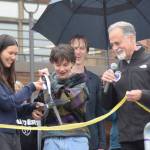 Homer High School Student Body President Marina Co and Vice President Reid Rauch cut the ribbon on Thursday, Sept. 11, 2025 while Kenai Peninsula Borough Mayor Peter Micciche and Homer High School Principal Eric Pederson look on. (Chloe Pleznac/Homer News)