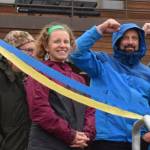 Homer Mayor Rachel Lord smiles as Homer High School counselor Paul Story and others raise a fist in jubilation for the completion of the new entrance to the school on Thursday, Sept. 11, 2025. (Chloe Pleznac/Homer News)