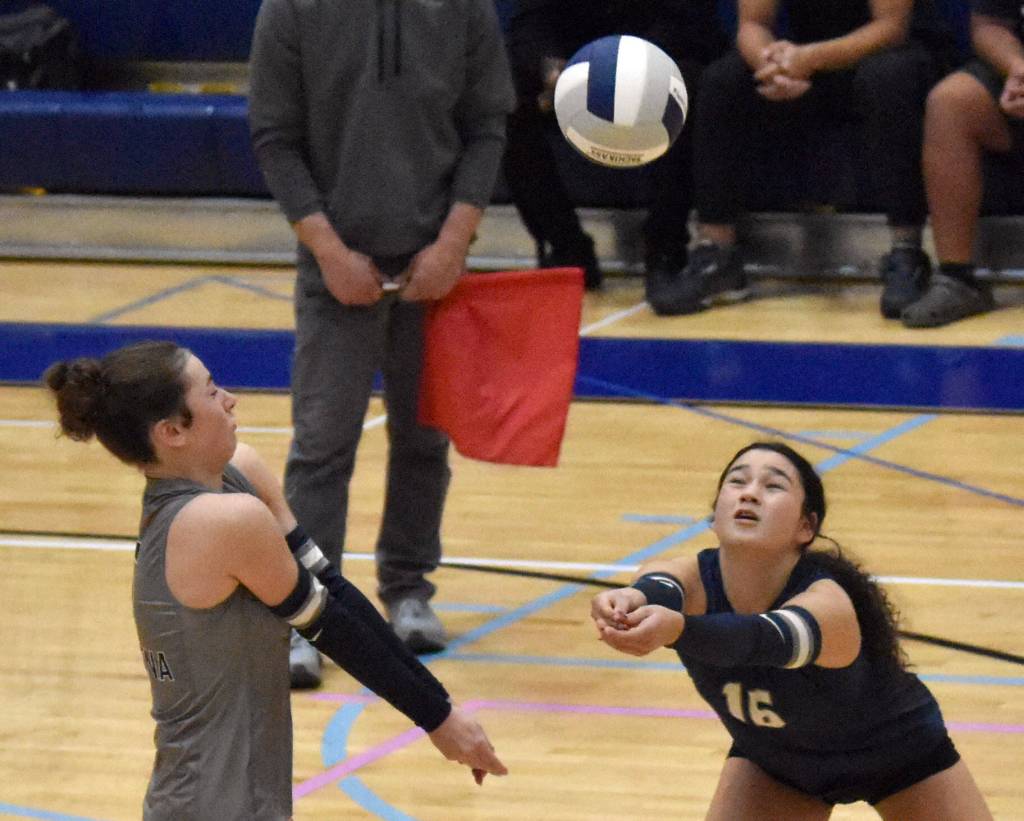 Soldotnas Grayson Henry and Samantha Piscoya dig up a ball against Seward on Thursday, Sept. 18, 2025, at Soldotna High School in Soldotna, Alaska. (Photo by Jeff Helminiak/Peninsula Clarion)